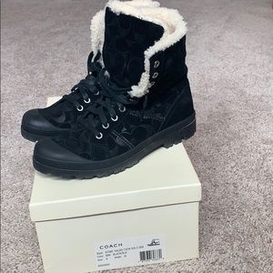 Coach boots black with hard sole.